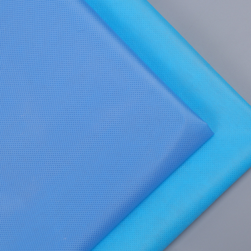 一次性蓝色防护服隔离衣淋膜无纺布PP+PE淋膜无纺布淋膜无纺布